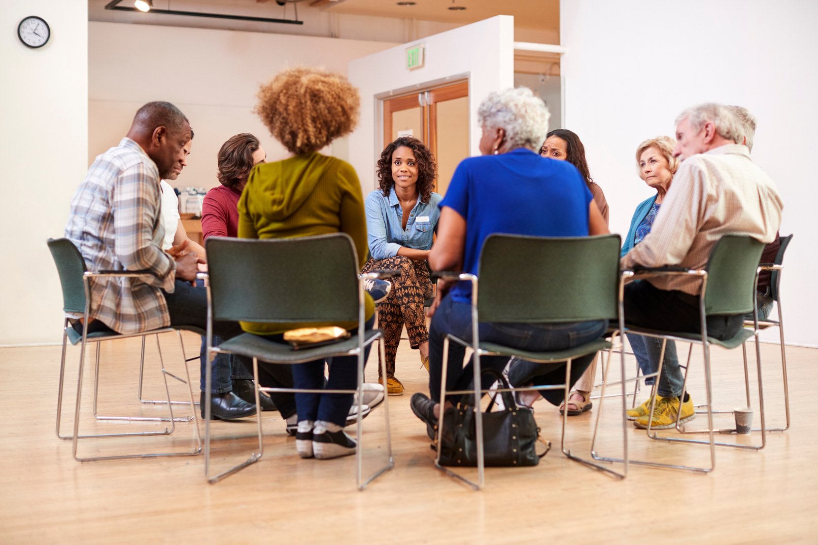 People Attending Self Help Therapy Group Meeting in Community Ce